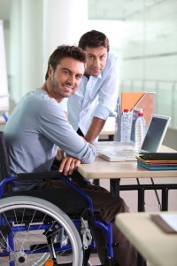 A man with disability working in office.