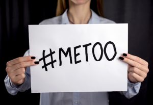 An employee with a #MeToo sign.